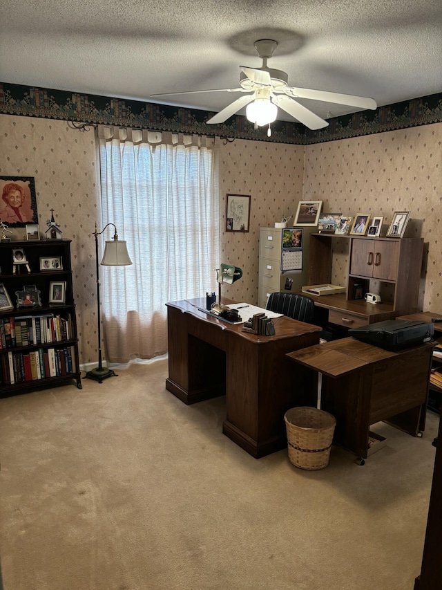 office area featuring a textured ceiling and wallpapered walls