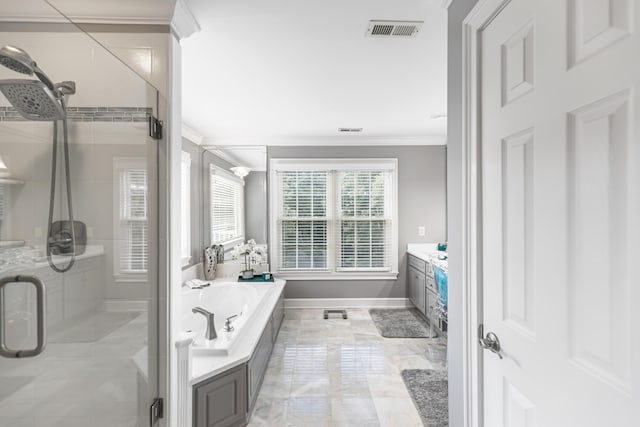 bathroom with vanity, separate shower and tub, and crown molding