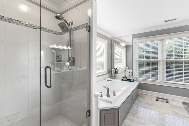 bathroom featuring ornamental molding and independent shower and bath