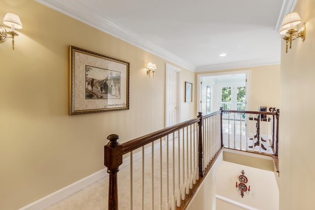 hallway featuring carpet floors and ornamental molding