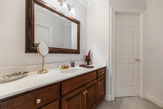 bathroom with vanity and ornamental molding