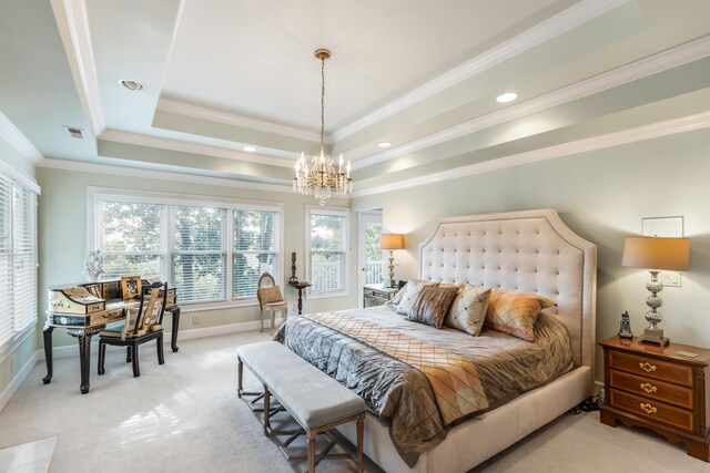 carpeted bedroom featuring a chandelier, a tray ceiling, and ornamental molding