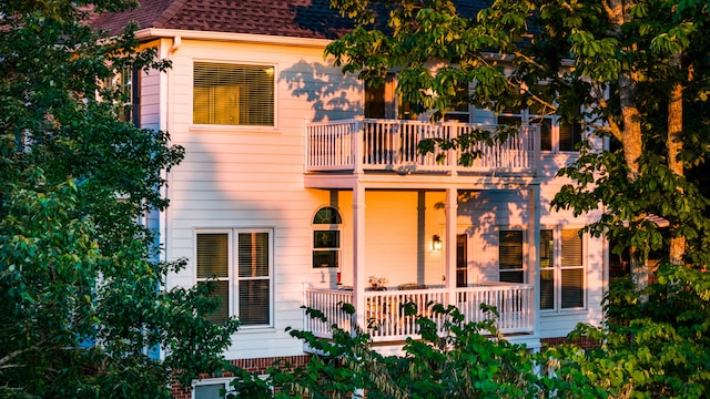 rear view of house with a balcony