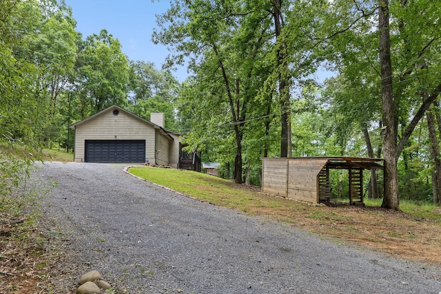 6300 Davis Hill Rd, Harrison, TN 37341 - view of front facade featuring a chimney, an outbuilding, and a detached garage