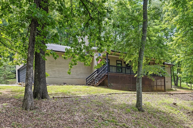 6300 Davis Hill Rd, Harrison, TN 37341 - view of yard featuring stairs, covered porch, and a garage