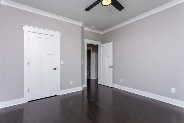 unfurnished bedroom featuring ceiling fan, ornamental molding, and dark hardwood / wood-style flooring