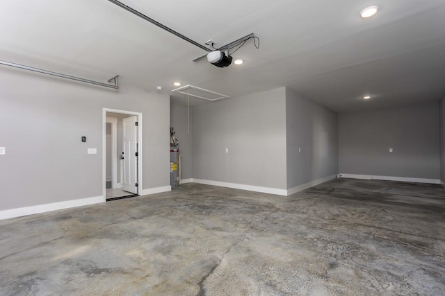 garage with a garage door opener and gas water heater