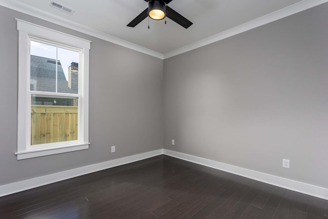 empty room featuring ceiling fan, dark hardwood / wood-style flooring, and ornamental molding