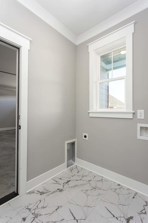 spare room with crown molding