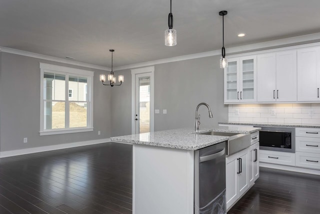 kitchen with stainless steel dishwasher, decorative backsplash, and white cabinetry