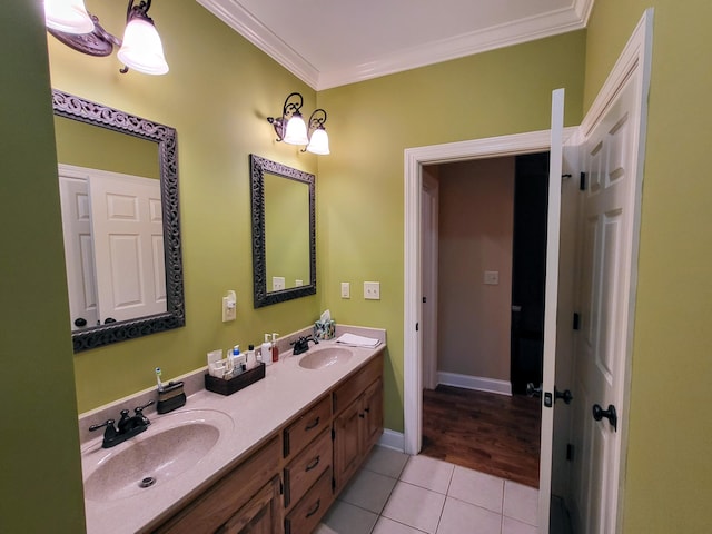 bathroom featuring vanity, tile patterned floors, and ornamental molding