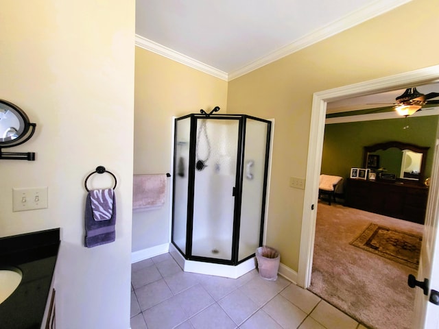 bathroom featuring vanity, ornamental molding, tile patterned floors, and walk in shower