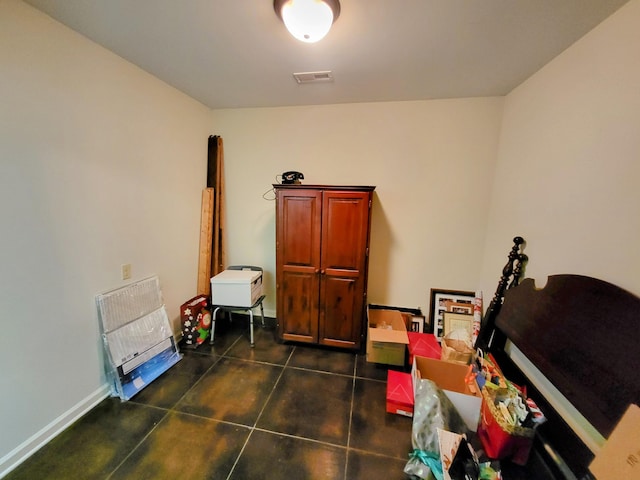 miscellaneous room featuring dark tile patterned flooring