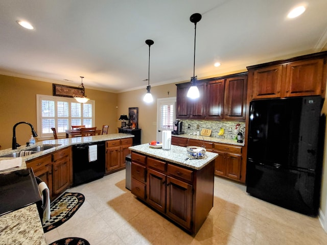 kitchen with pendant lighting, sink, ornamental molding, a center island, and black appliances