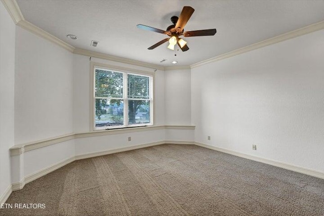 unfurnished room with ornamental molding, carpet flooring, and ceiling fan