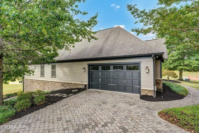 view of side of property with a garage