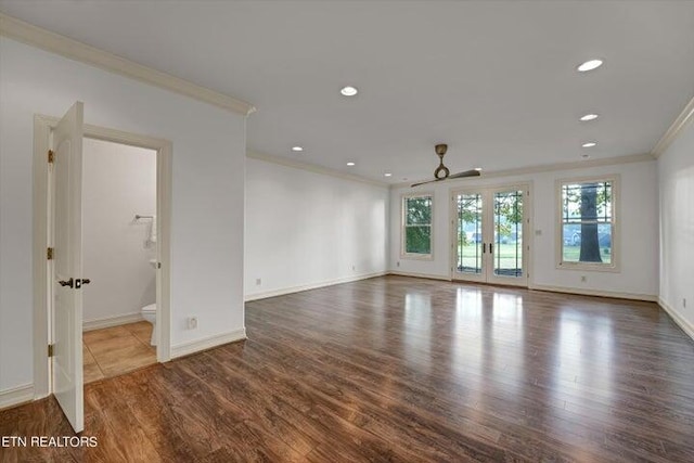 spare room with french doors, ornamental molding, and wood-type flooring