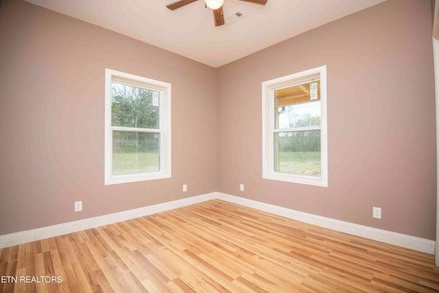 unfurnished room with ceiling fan and light hardwood / wood-style flooring