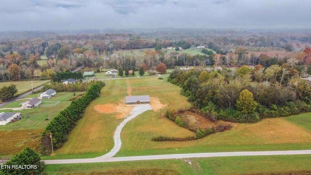 birds eye view of property with a rural view