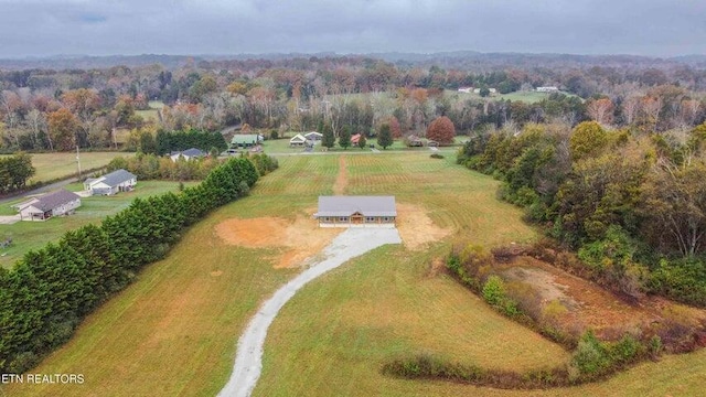 birds eye view of property with a rural view