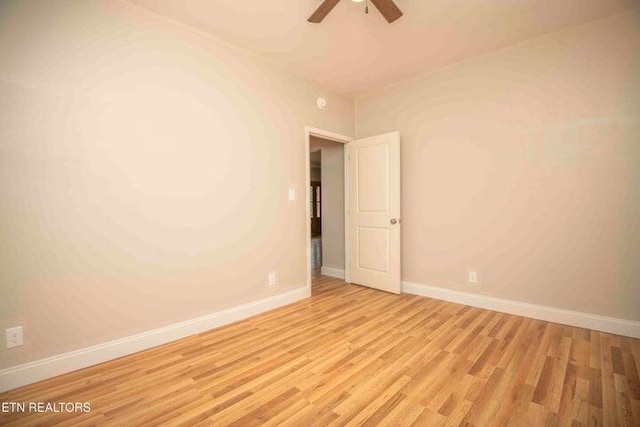 empty room featuring ceiling fan and light hardwood / wood-style flooring