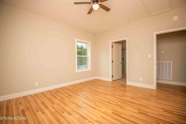 spare room with light hardwood / wood-style floors and ceiling fan