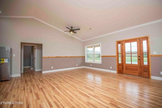 unfurnished living room featuring ceiling fan, light hardwood / wood-style floors, lofted ceiling, and ornamental molding