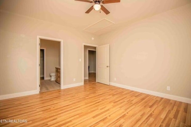 empty room with ceiling fan and light hardwood / wood-style floors