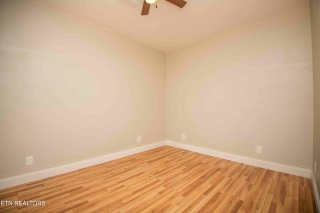 spare room with ceiling fan and light wood-type flooring