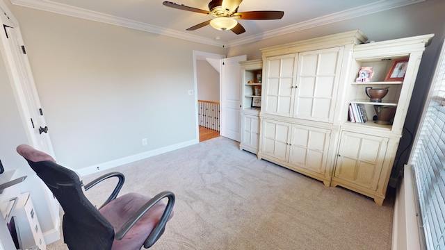 living area with ceiling fan, light colored carpet, and crown molding