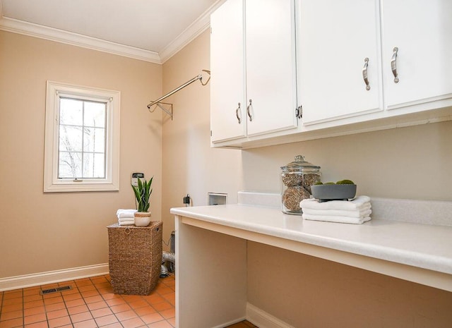 laundry area featuring light tile patterned floors, cabinet space, visible vents, ornamental molding, and baseboards