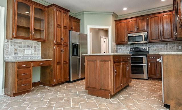 kitchen featuring stainless steel appliances, decorative backsplash, and crown molding