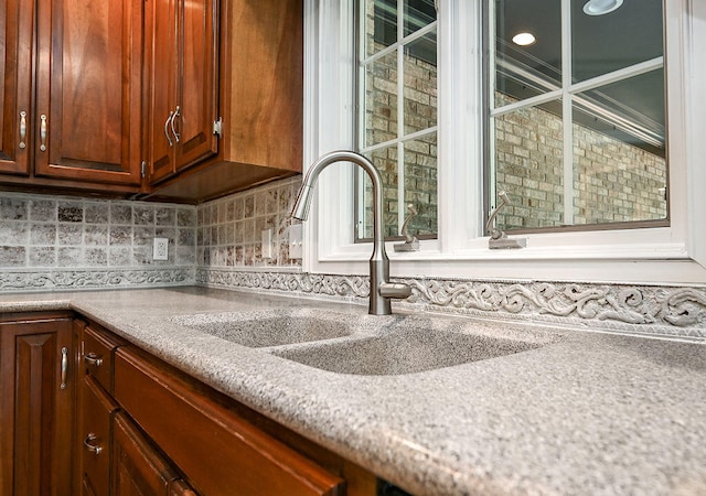 kitchen with decorative backsplash and sink