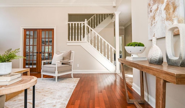 living area with dark wood-style flooring, baseboards, french doors, ornamental molding, and stairway