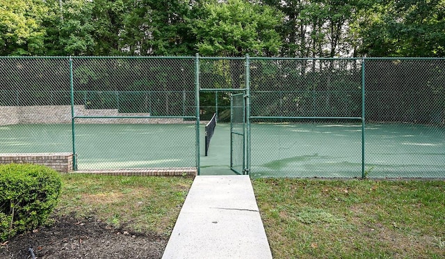 view of sport court featuring a gate and fence