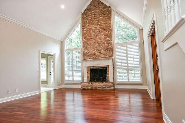 unfurnished living room with a fireplace, high vaulted ceiling, dark wood-type flooring, and crown molding