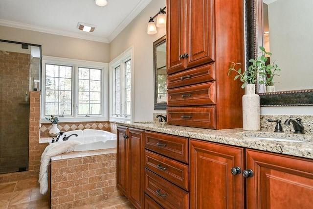 full bath featuring ornamental molding, a garden tub, a sink, and double vanity