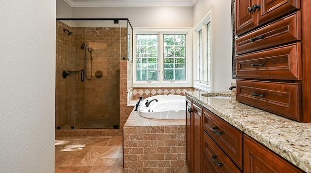 bathroom with vanity, ornamental molding, and separate shower and tub