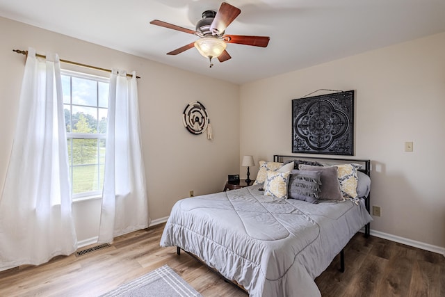 bedroom featuring hardwood / wood-style floors and ceiling fan