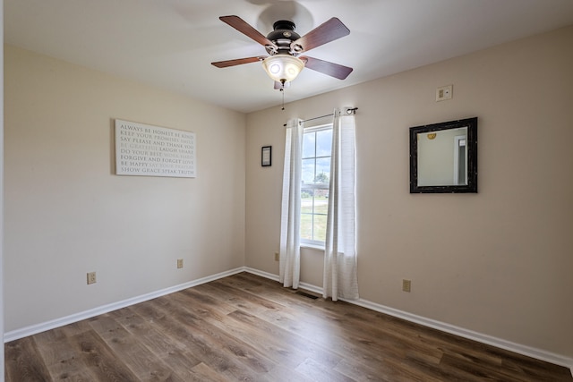 spare room featuring ceiling fan and hardwood / wood-style flooring