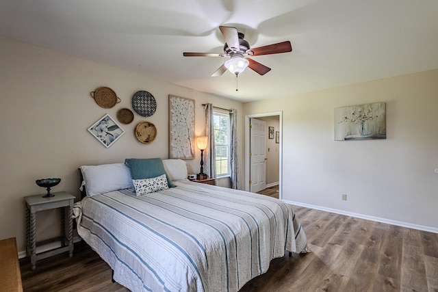 bedroom featuring dark hardwood / wood-style floors and ceiling fan