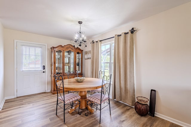 dining room featuring a chandelier and hardwood / wood-style floors