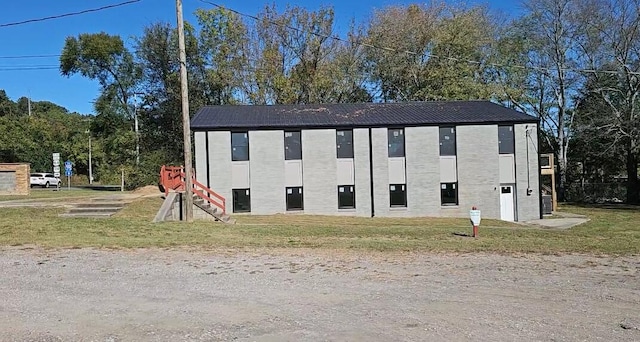 exterior space with a front lawn