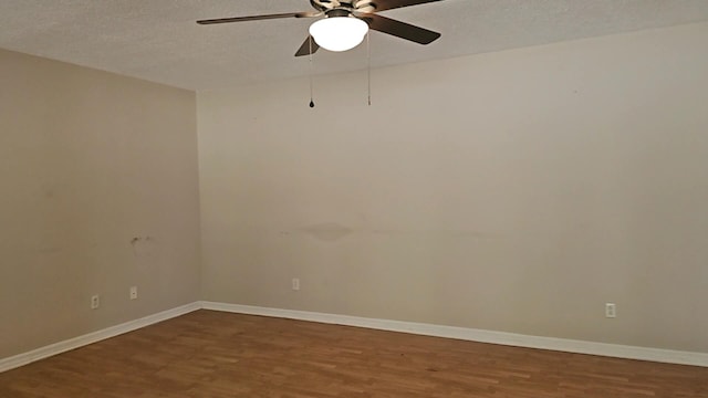 empty room featuring a textured ceiling, hardwood / wood-style flooring, and ceiling fan