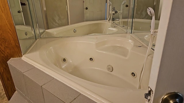 bathroom featuring a relaxing tiled tub