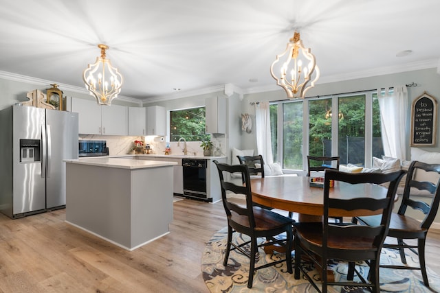 364 Hidden Oaks Trl, Cleveland, TN 37312 - dining area featuring a chandelier, crown molding, and light wood-type flooring