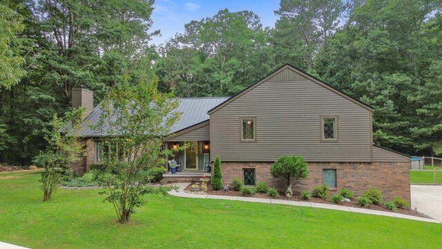 364 Hidden Oaks Trl, Cleveland, TN 37312 - split level home with a front lawn, brick siding, and a chimney