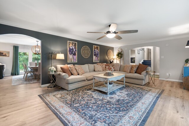 364 Hidden Oaks Trl, Cleveland, TN 37312 - living area with arched walkways, light wood-type flooring, a ceiling fan, crown molding, and a chandelier