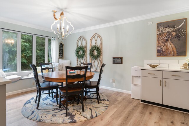 364 Hidden Oaks Trl, Cleveland, TN 37312 - dining room with light wood-style flooring, crown molding, and a chandelier