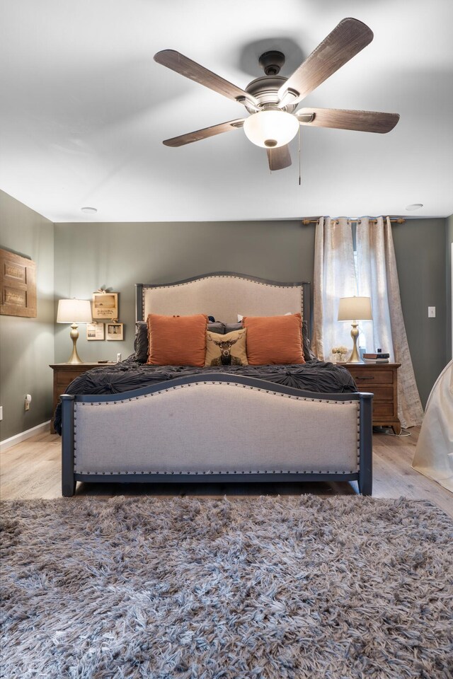 364 Hidden Oaks Trl, Cleveland, TN 37312 - bedroom featuring light wood finished floors and ceiling fan
